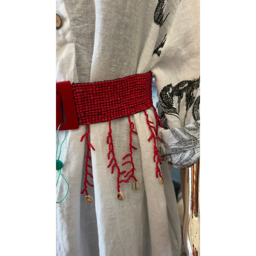 Antica Sartoria elastic belt features red glass seed beads a seashell fringe